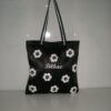 Confección diversa producción textil de bolsas forradas, bordadas con el nombre de Bilbao, apliques a croché en forma de flor,